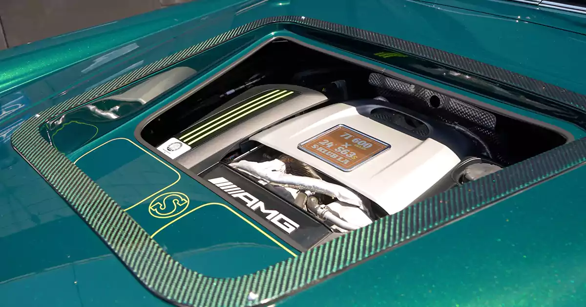 A hood cutout reveals the 800-hp AMG S63 hybrid V8 hidden beneath this 1971 Mercedes 600 Pullman.